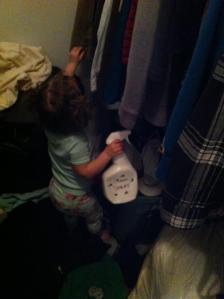 Spraying our closet for monsters with her Monster Spray